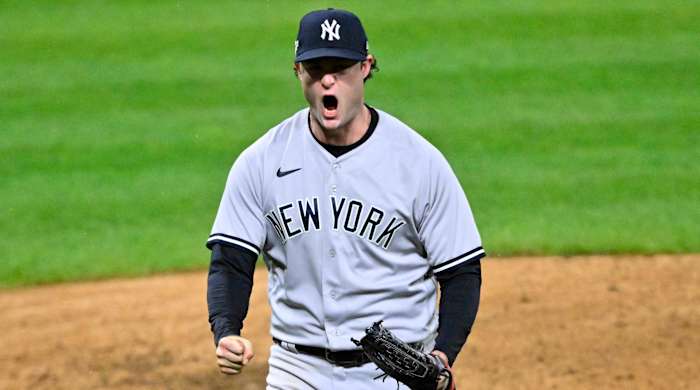 Yankees pitcher Gerrit Cole yells in celebration after finishing the seventh inning of Game 4 of the 2022 ALDS.
